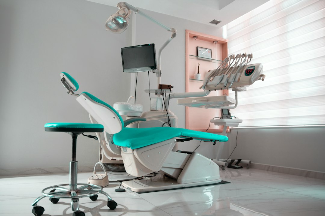 Modern dental operatory with patient chair and monitor