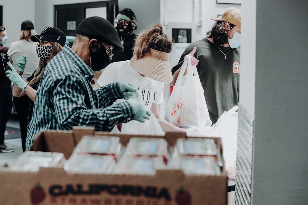 Volunteers organizing boxes for a community service program