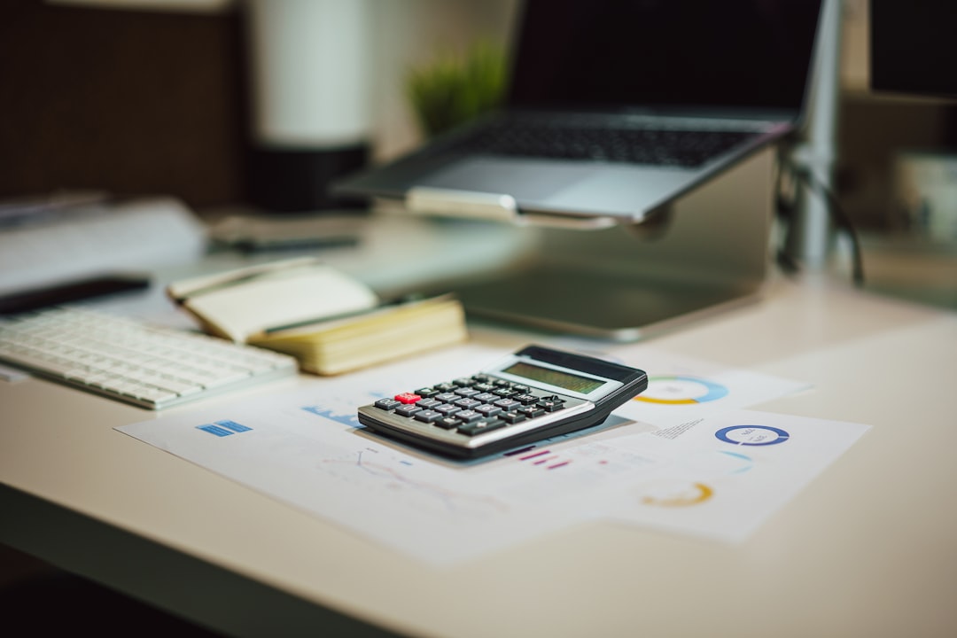 Calculator and financial documents on an accounting office desk